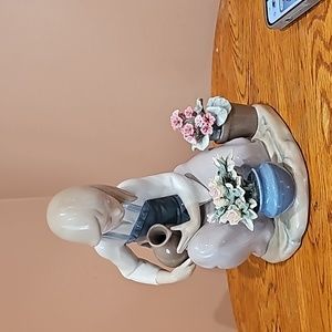 Lladro women watering flowers